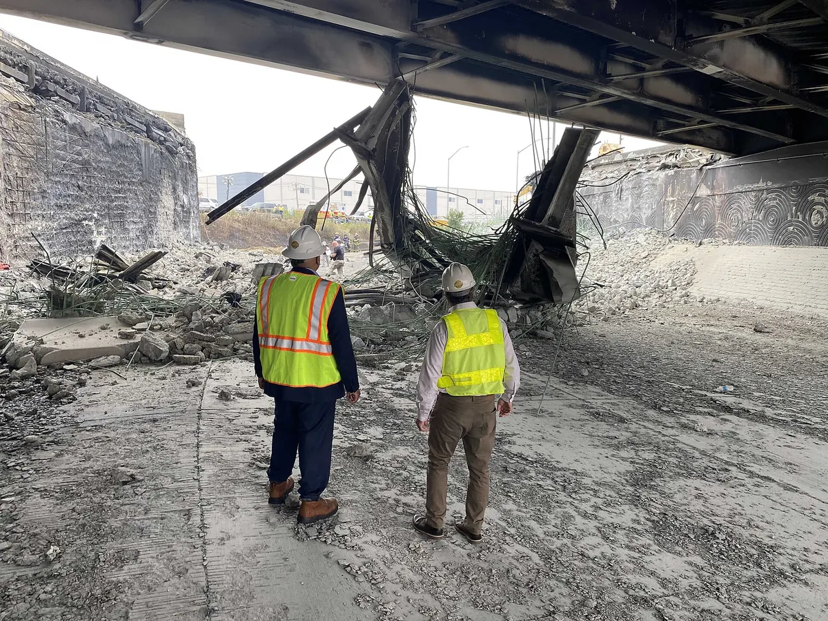 Federal Highway Administration officials inspecting the collapsed I-95 span in Philadelphia, June 12, 2023